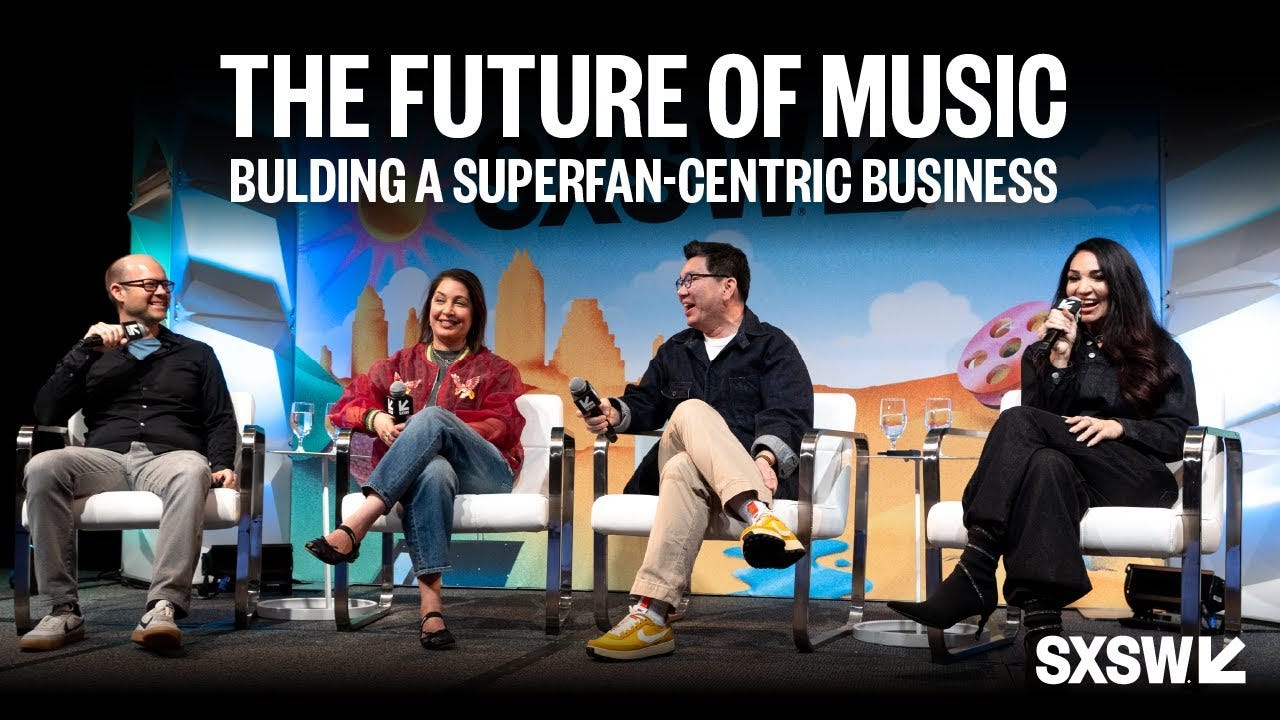 A picture of four people sitting in chairs on a stage. The following text is overlayed at the top: "The Future of Music: Building a Superfan-centric business." The SXSW logo sits at the bottom right.