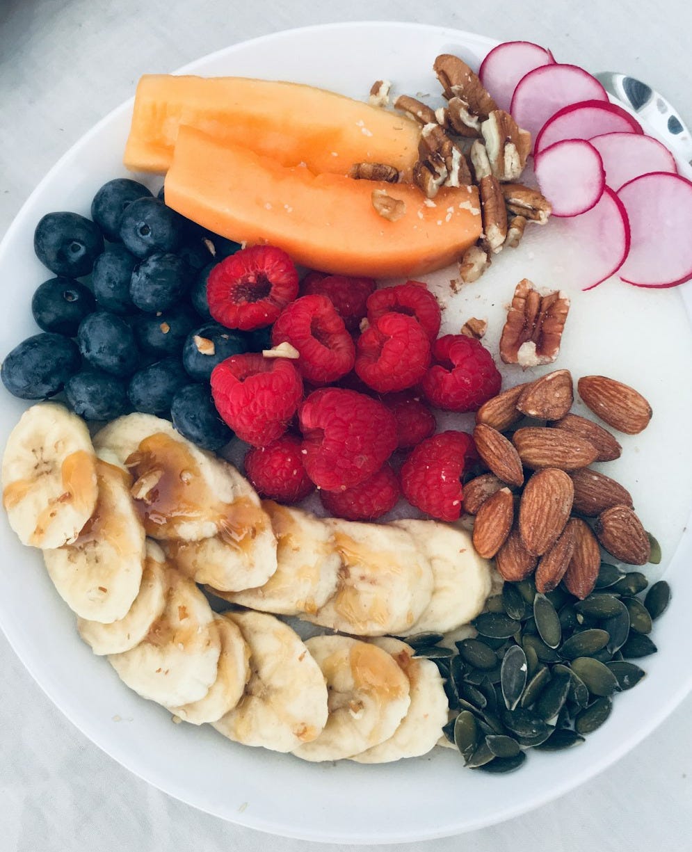 sliced fruits on white ceramic plate