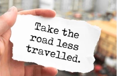 A hand holding a piece of paper

Description automatically generated