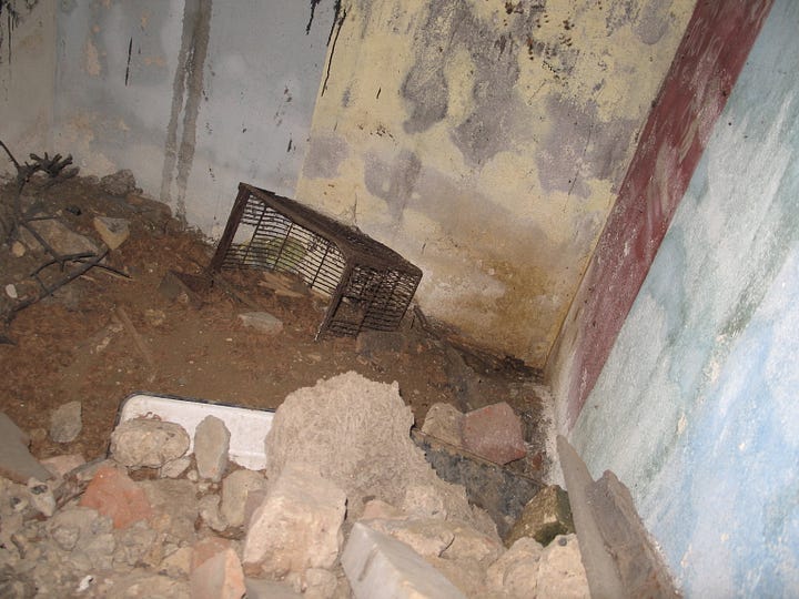 A series of images showing the air raid shelter pre-restoration. The walls are dirty and cobweb ridden, covered in graffiti and the floor is covered in rubble and dirt.