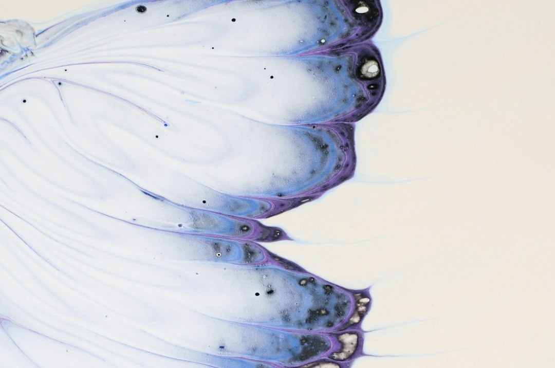 a painting of a white bird with blue feathers