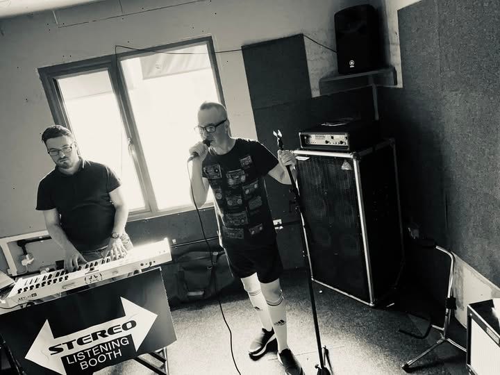 May be an image of 2 people and text