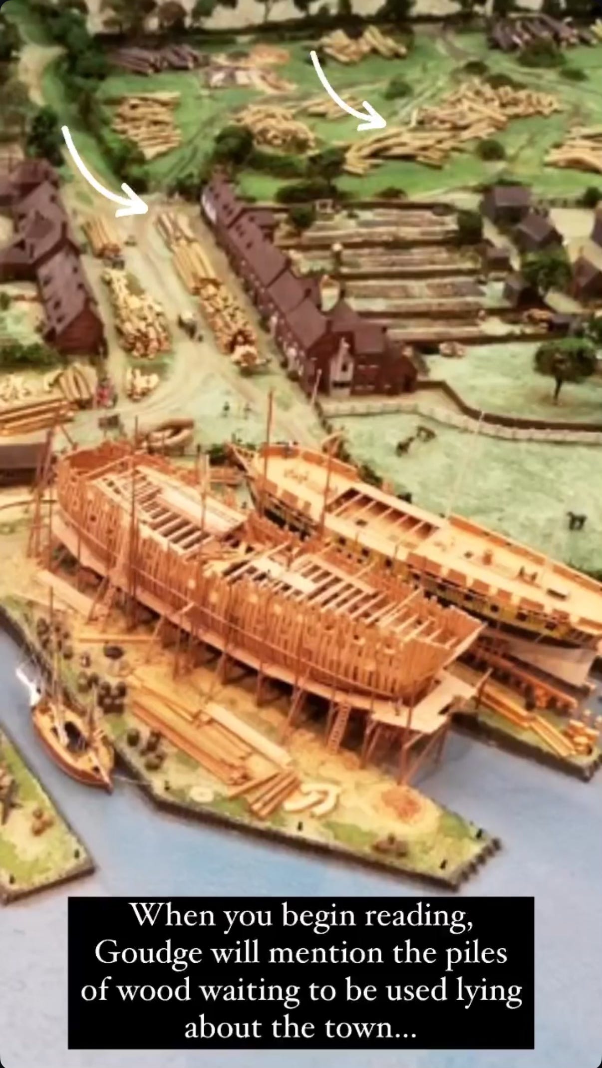 When you begin reading, Goudge will mention the piles of wood lying about the roads of the Hard. This model shows stacks of logs lying by the road down to the place the ship is being built by the water.