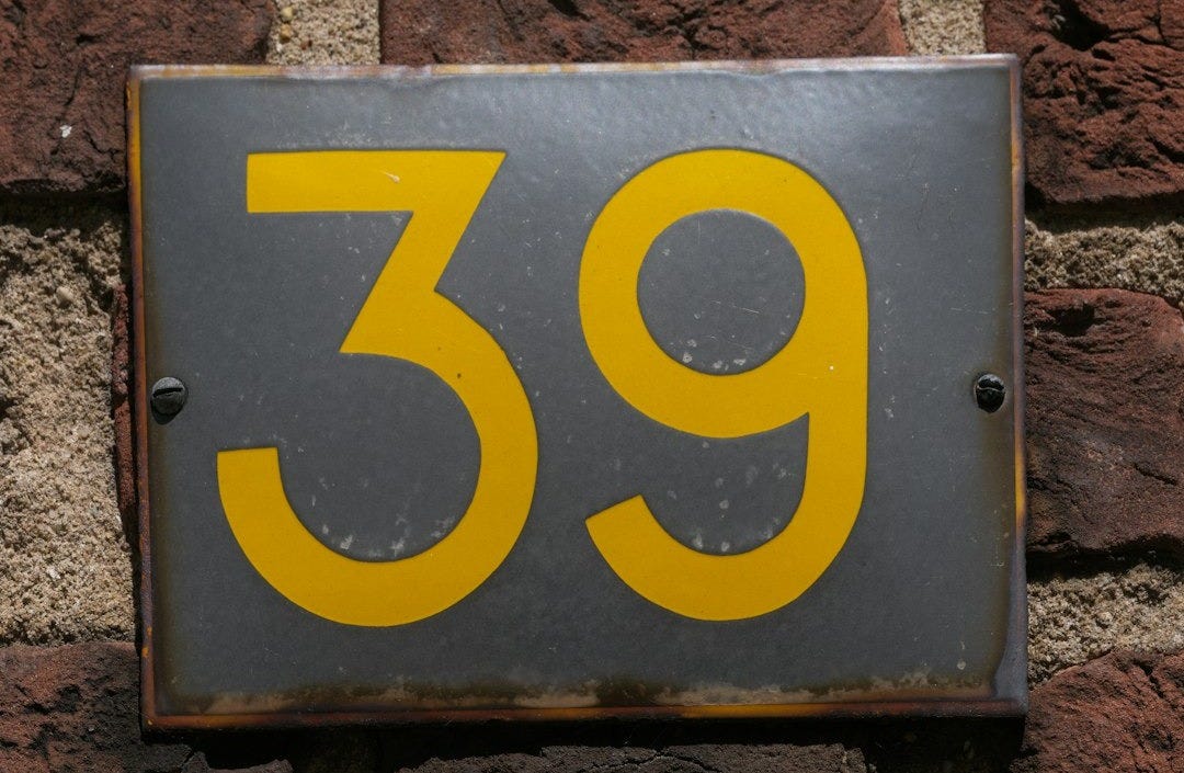 The number 39 is displayed on a brick wall.