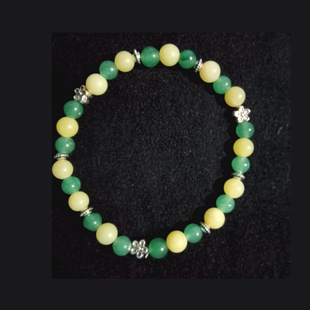 Green and yellow bracelet on a black background Green and yellow bracelet on a black background