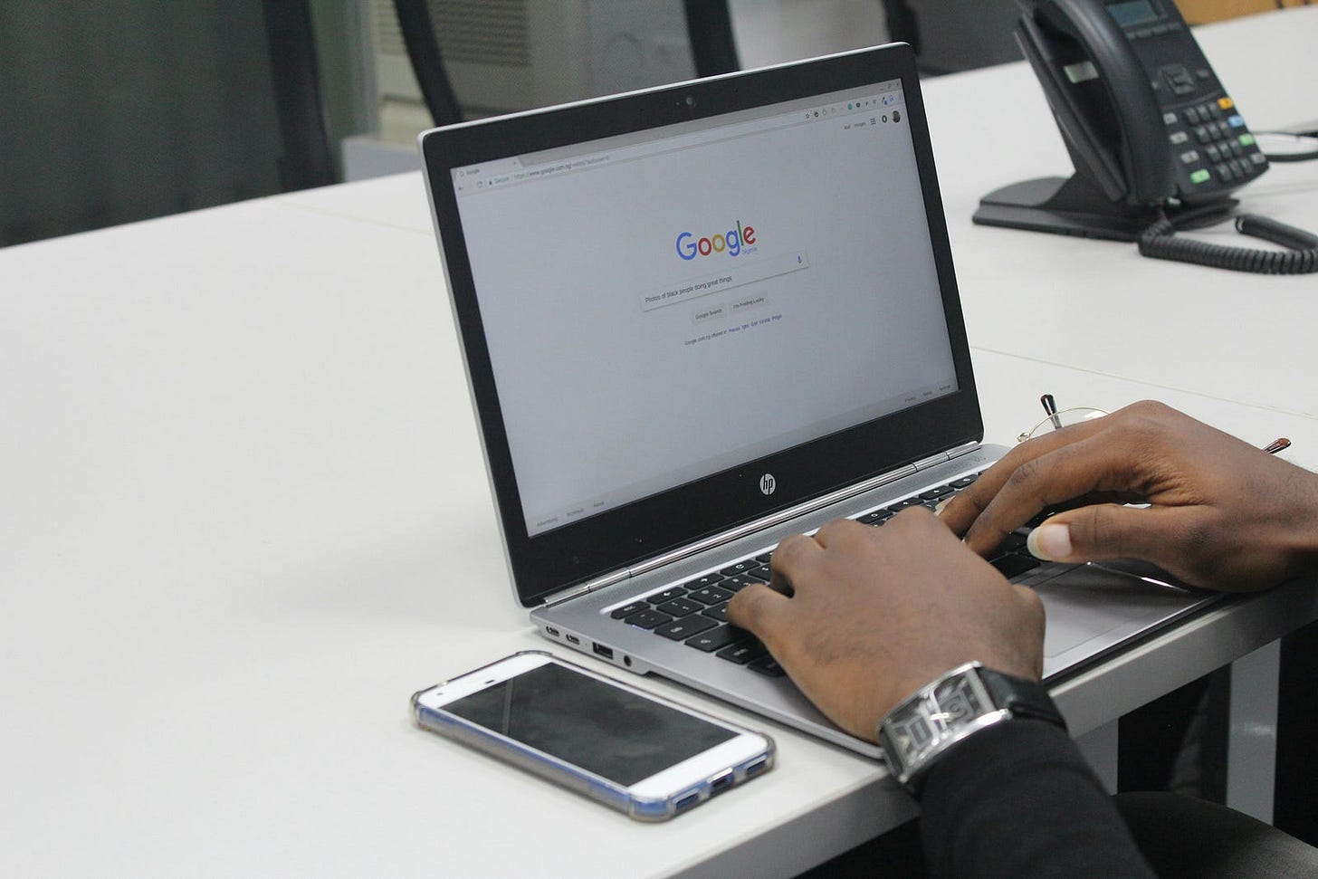 A man on a laptop socializing