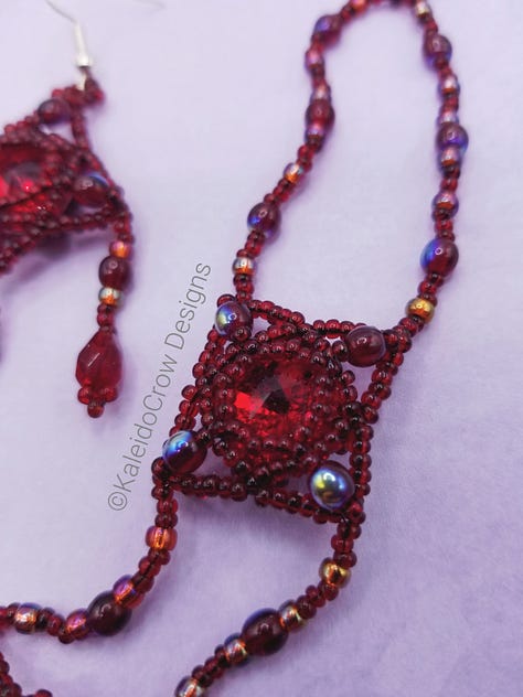Closeups of a deep red beaded necklace with glass beads