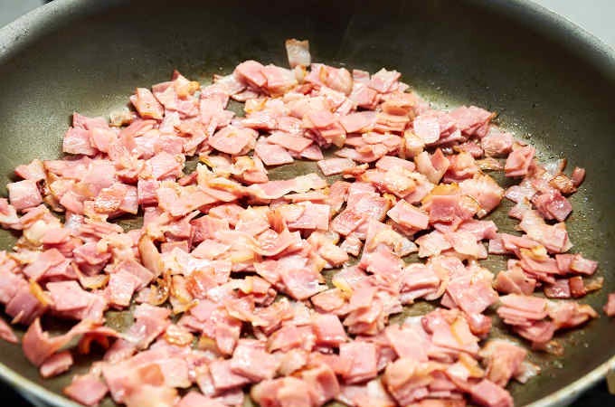 chopped bacon in pan chopped bacon in pan