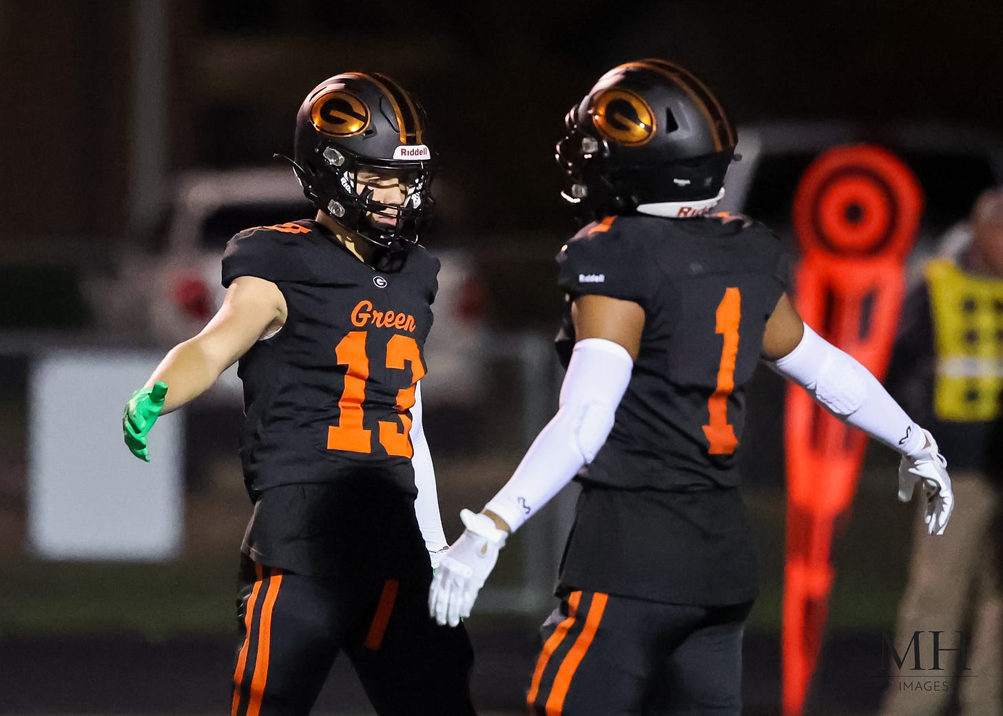 May be an image of 3 people, people playing football and text that says 'Riddell Green'