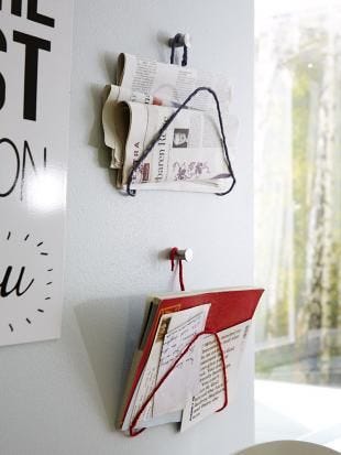 This may contain: there is a clock on the wall next to some posters This may contain: there is a clock on the wall next to some posters