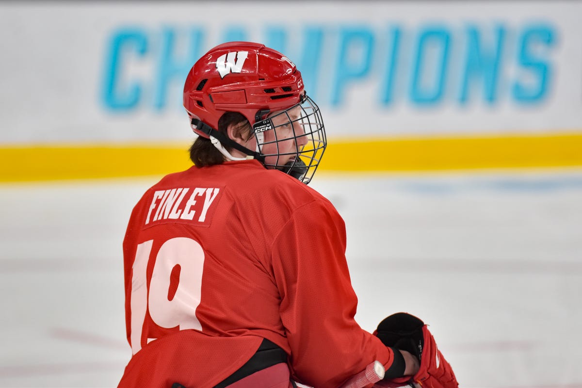 Quinn Finley side profile red ccm helmet white Wisconsin logo