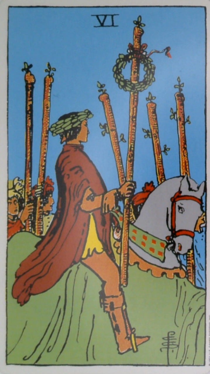 The 6 of Wands tarot card and the Wait oracle card.