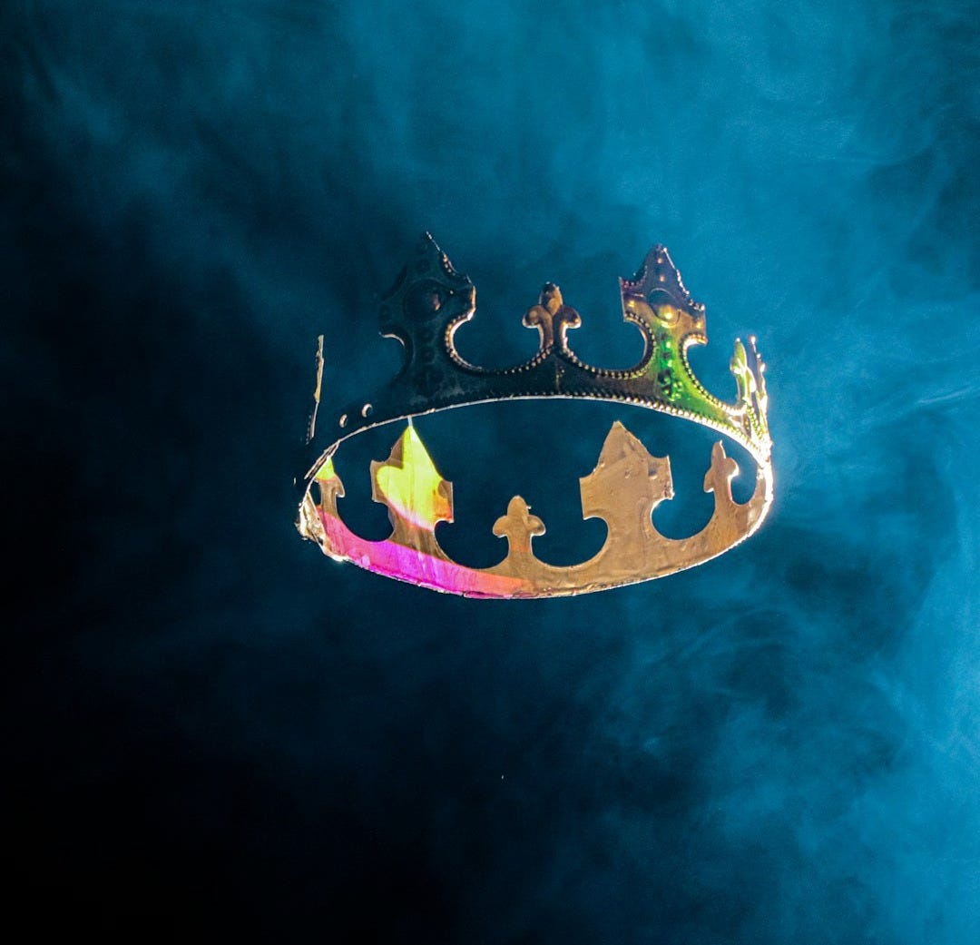 a logo with a crown