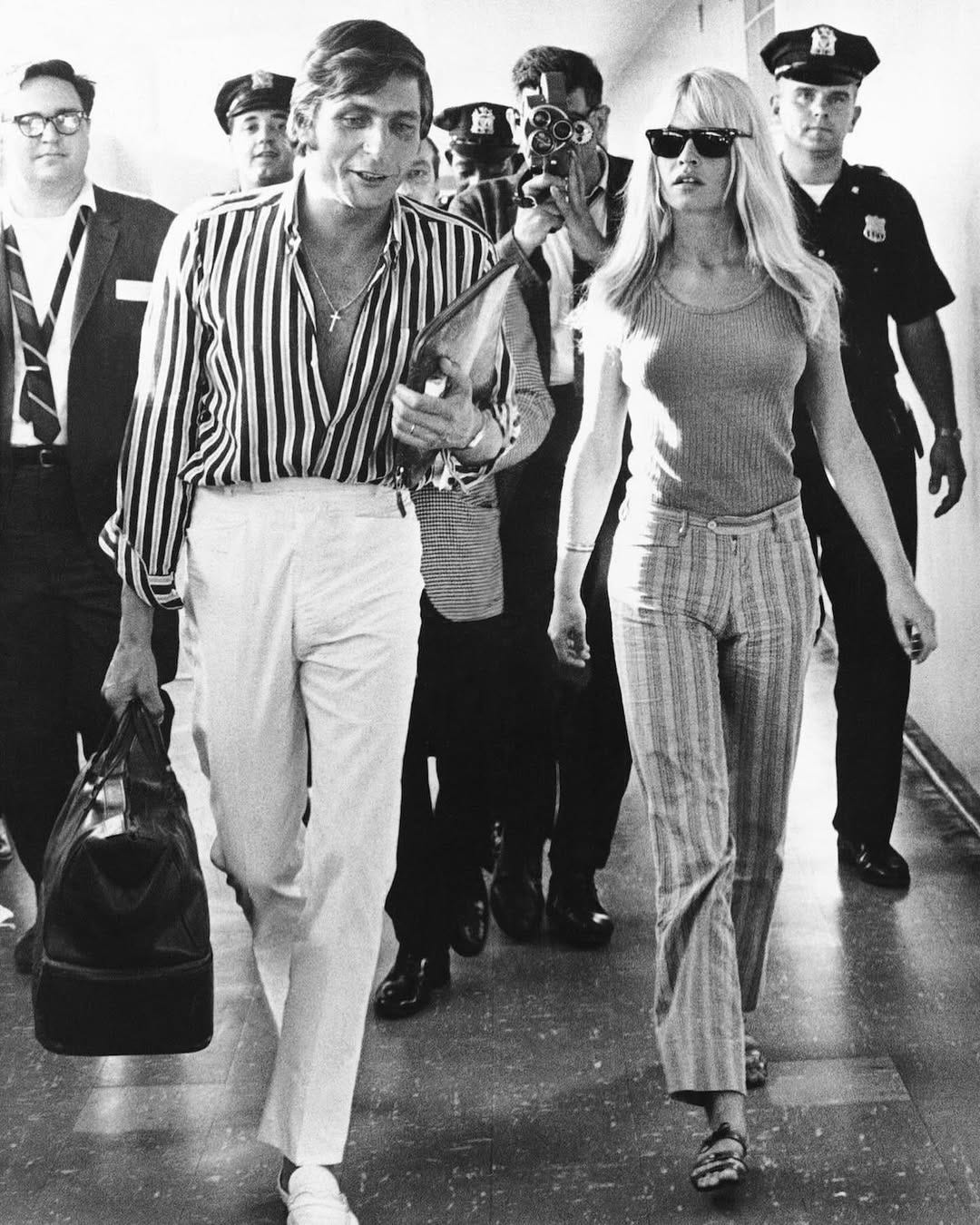 Brigitte Bardot and Gunther Sachs von Opel at JFK Airport wearing stripes