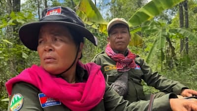 Chhum Khim, left, leads a community patrol of the Preah Roka Wildlife Sanctuary in Cambodia.
