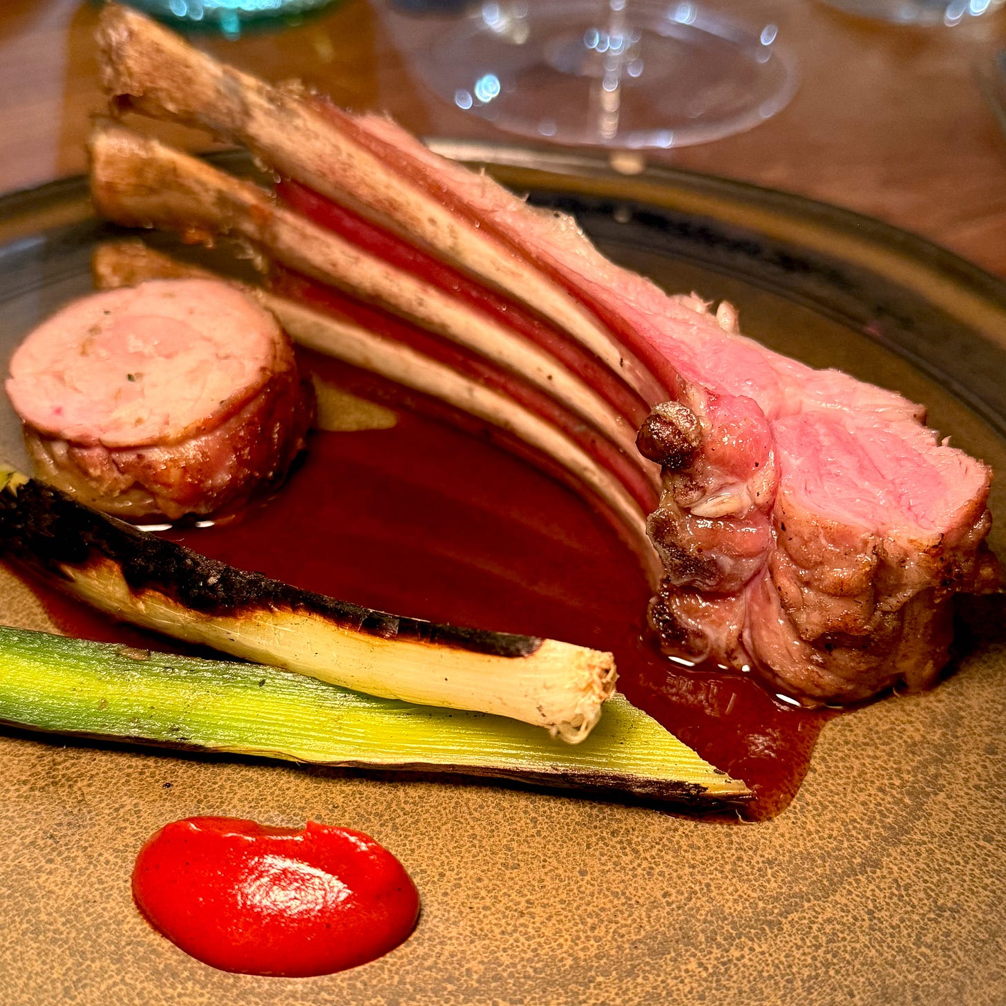 Lamb rack and roulade with charred green onion and harissa at Masaikuta, Paris 11th