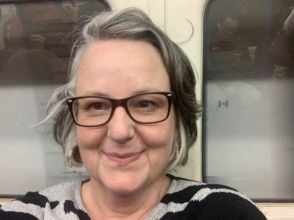 A person with glasses smiling

AI-generated content may be incorrect.