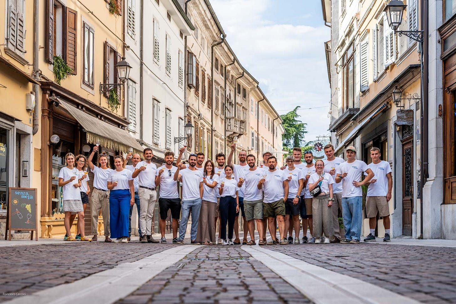 The 25 founding members of Senza Meja, outside their enoteca in Gorizia. Photo: Francesco Cecconi
