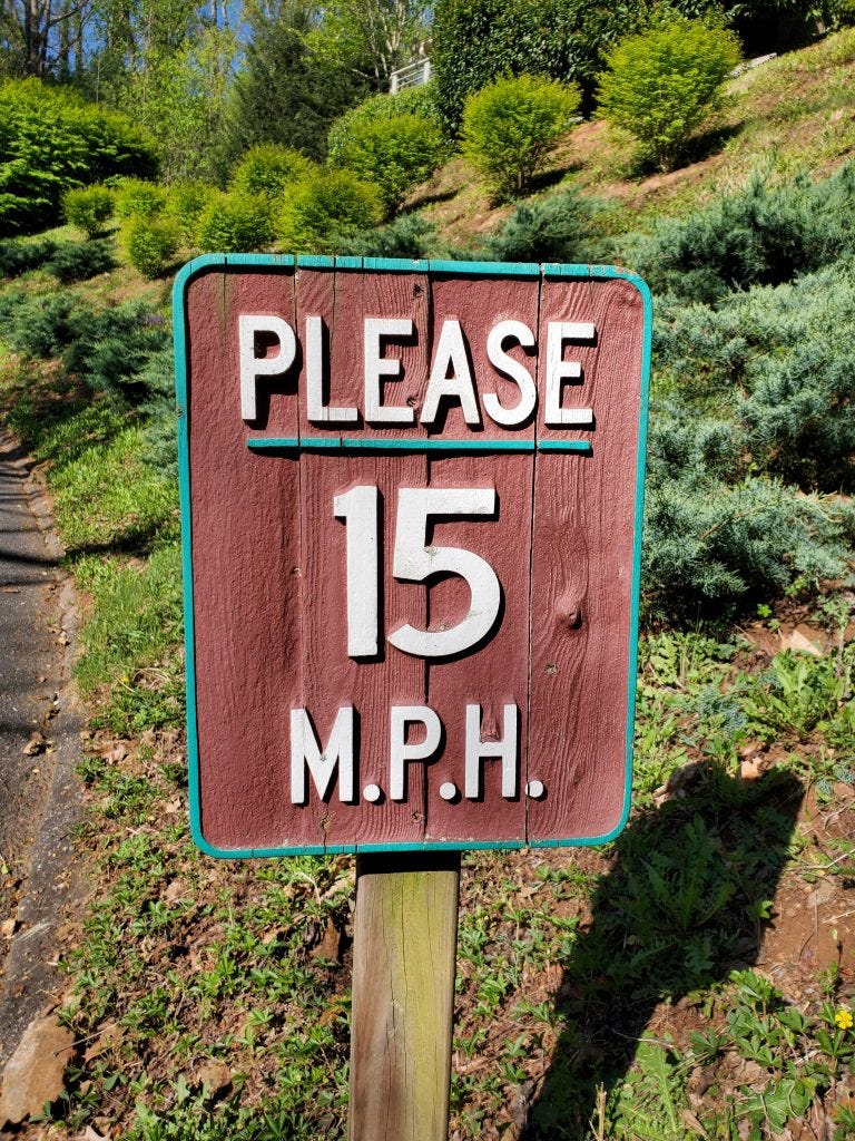 old wood spped sign old wood spped sign