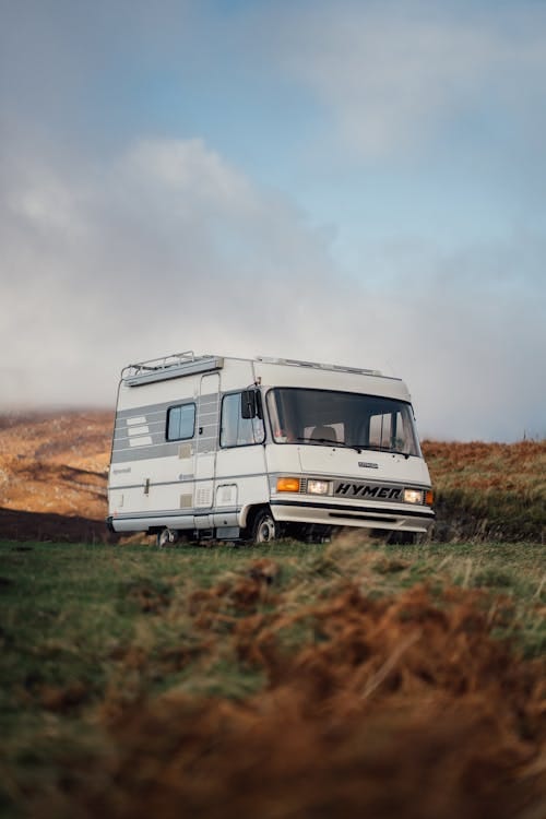 Free A solitary camper van parked in the scenic countryside of Lairg, Scotland. Stock Photo