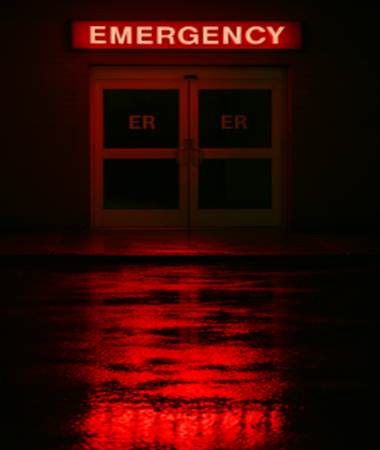 A red light reflecting on a building