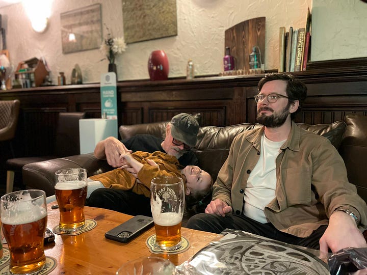 Family with a young girl in a pub in the UK