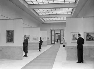 People in a museum looking at art

AI-generated content may be incorrect.