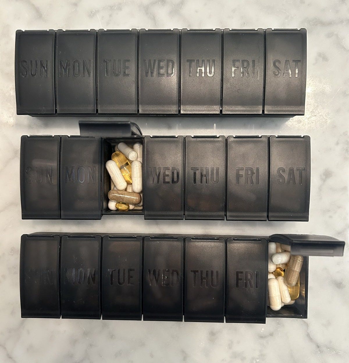 Pill organizers filled with a few weeks of supplements