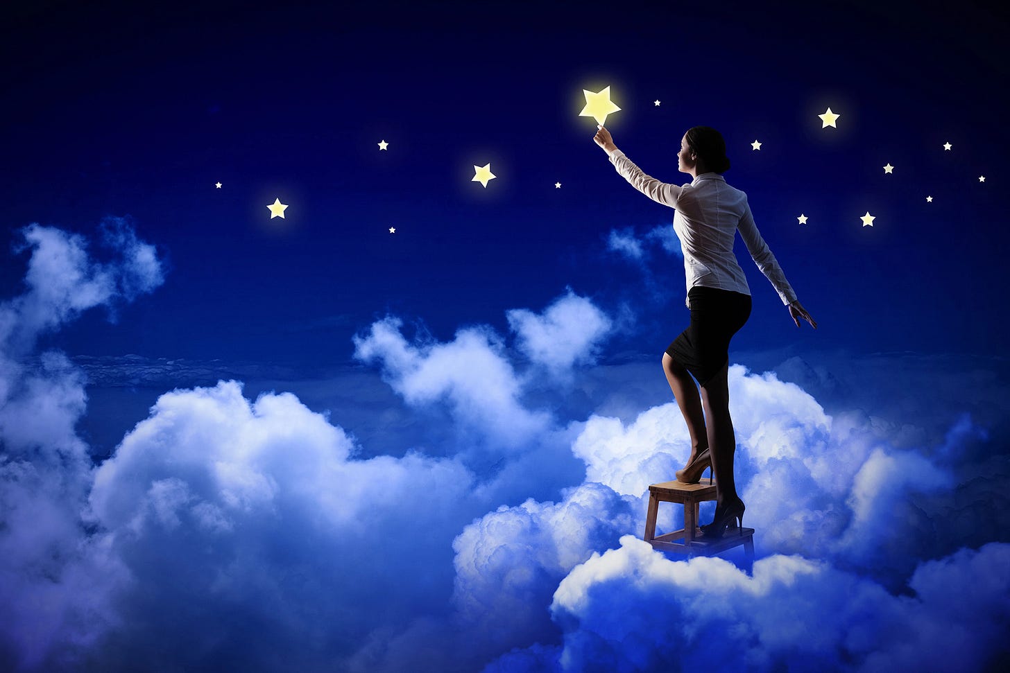 Woman on a ladder in the clouds reaching for the stars