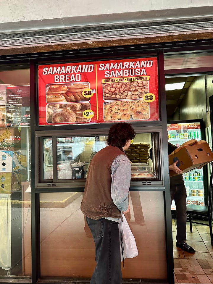 David ordering samsa as a box of lepyoshka is carried out of the bakery; the tandir oven