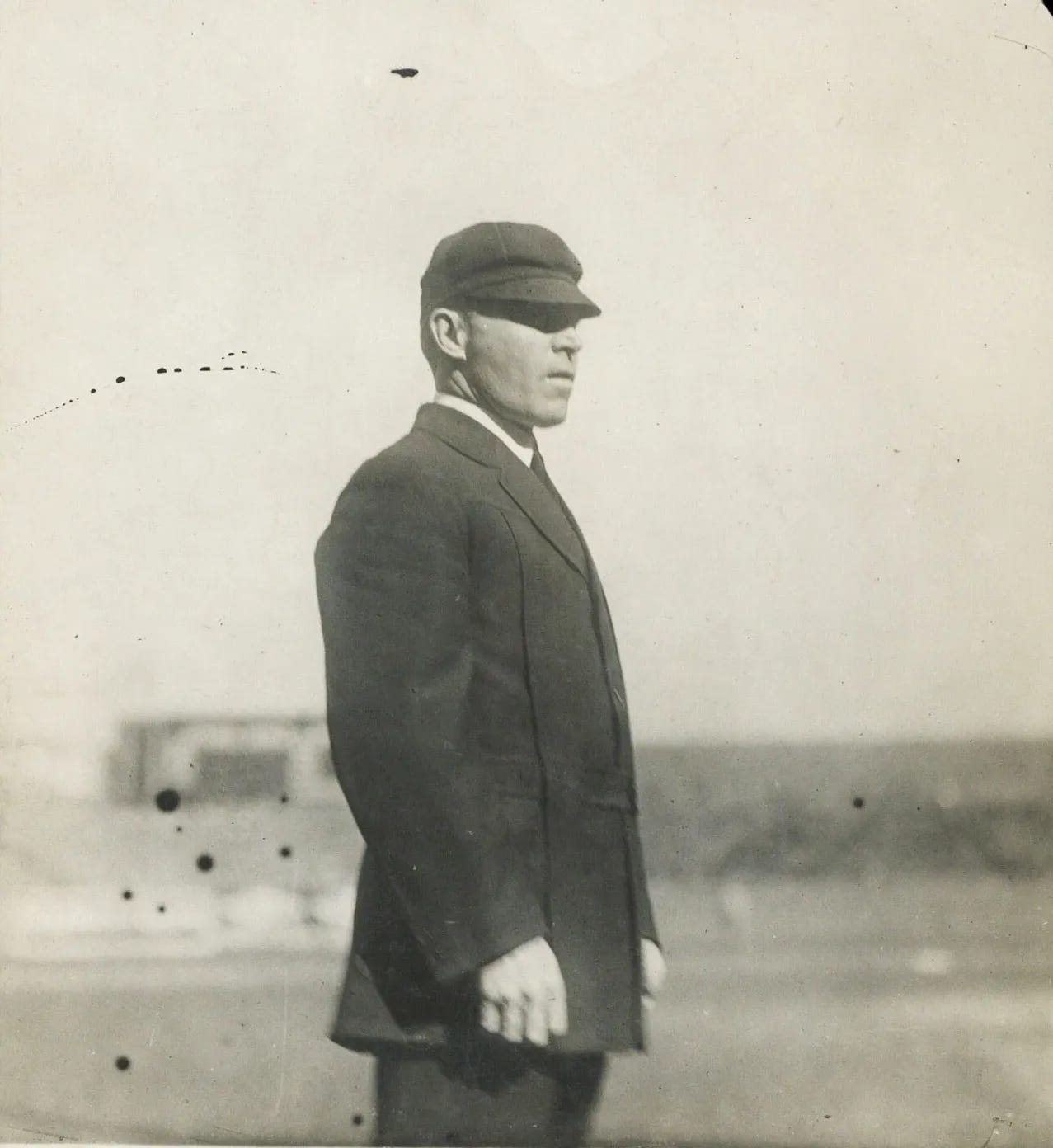 Bill Byron standing in the field. Bill Byron standing in the field.