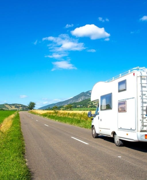 May be an image of campsite, van and road