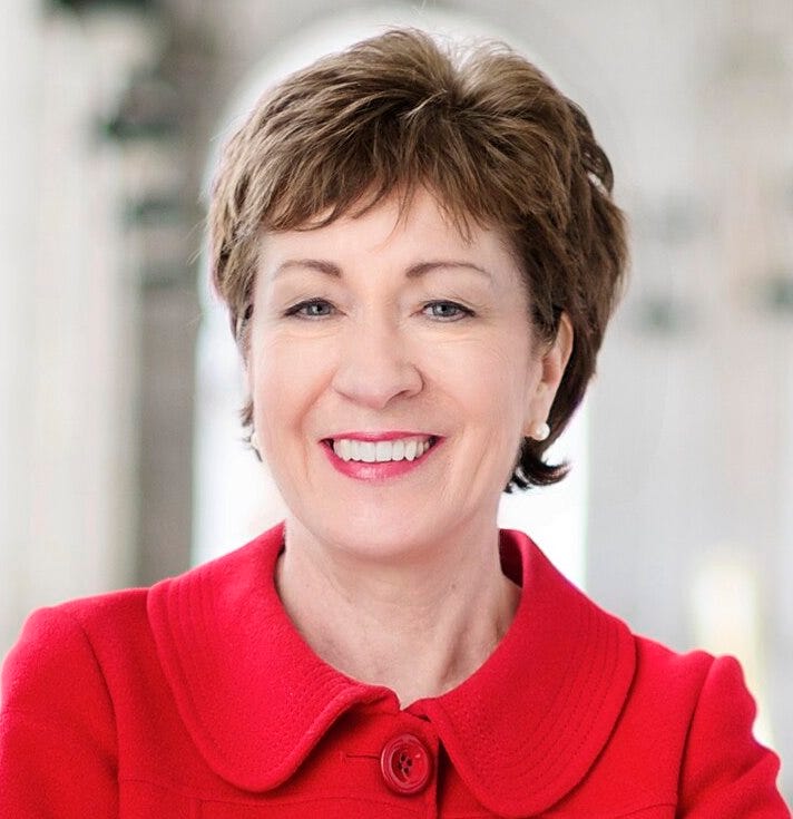 susan collins, white woman short brown hair, smiling, wearing red coat with large red button, c. 2014 susan collins, white woman short brown hair, smiling, wearing red coat with large red button, c. 2014