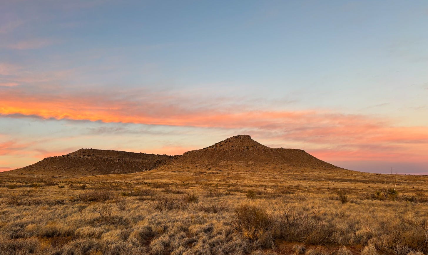 desert landscape with mountain at sunset