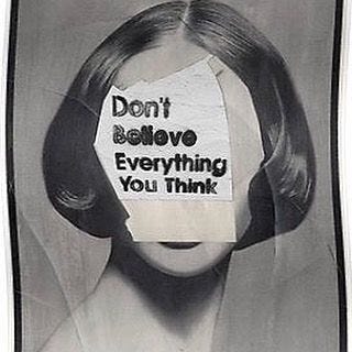 This may contain: a poster with the words don't believe everything you think is in front of it