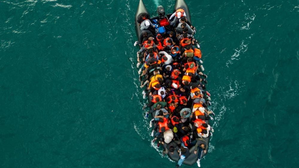 A drone view of an inflatable dinghy carrying migrants making its way towards the UK in the English Channel in August.