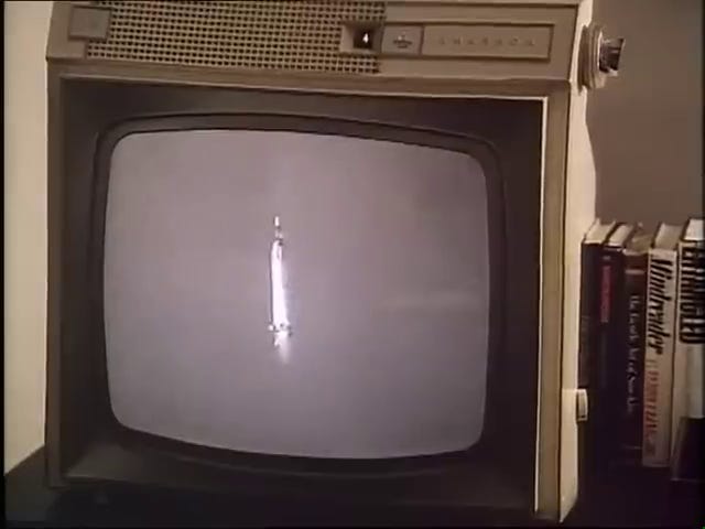 The Freedom 7 launch; Kennedy and his staff watch the launch on television.