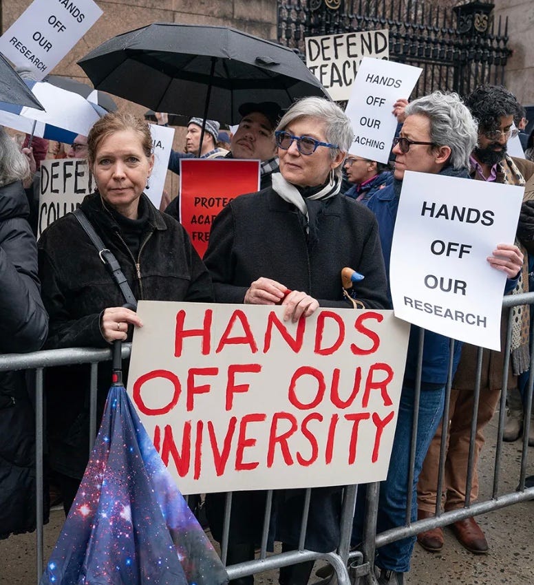 A group of people holding signs

AI-generated content may be incorrect.