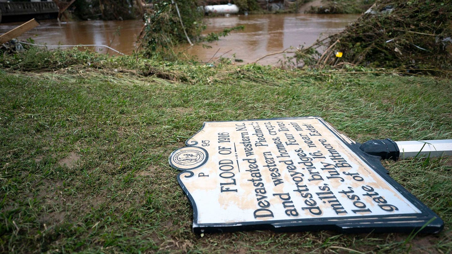 photo of a sign marking the "Flood of 1916" in Asheville, the previous worst flood in the area's history. Helene's floodwaters toppled the sign photo of a sign marking the "Flood of 1916" in Asheville, the previous worst flood in the area's history. Helene's floodwaters toppled the sign