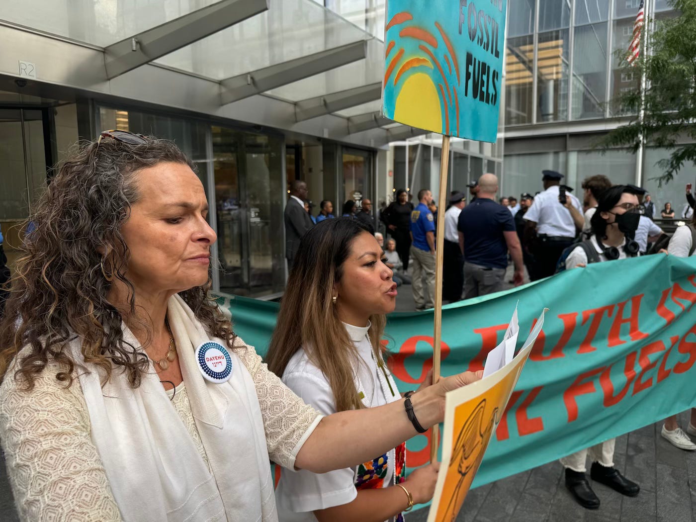 women holding protest signs