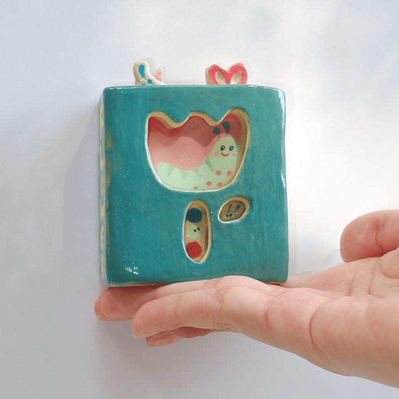 Handcrafted Ceramic Caterpillar Story Book: Interactive Kids' Toy image 1