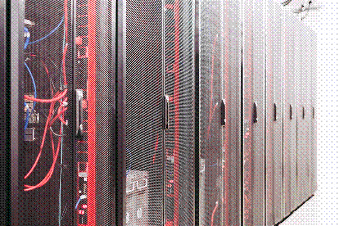 Title: Server racks in a data center - Description: Rows of server racks in a modern data center, representing the digital infrastructure underlying federal health data systems.