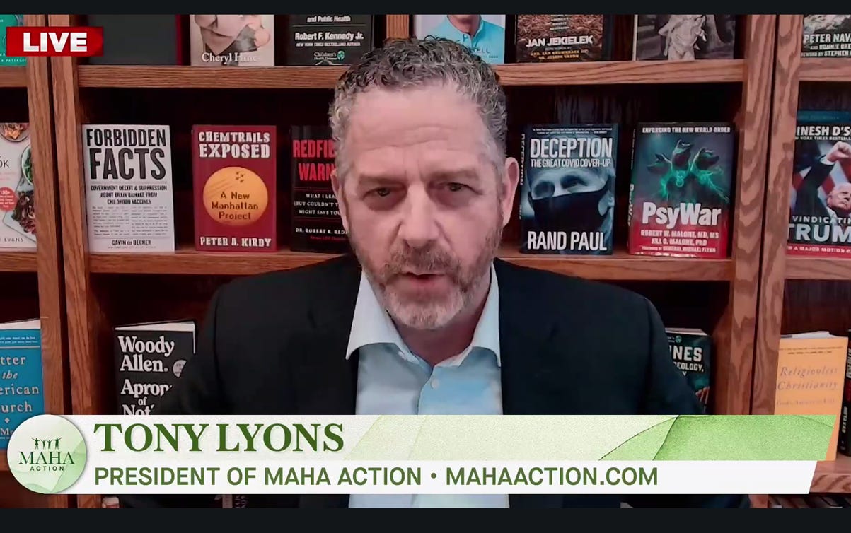 The image depicts a man in a suit and tie, speaking into a microphone, surrounded by various books and documents, with words and phrases related to political scandals and controversial topics on a black background.

AI-generated content may be incorrect.