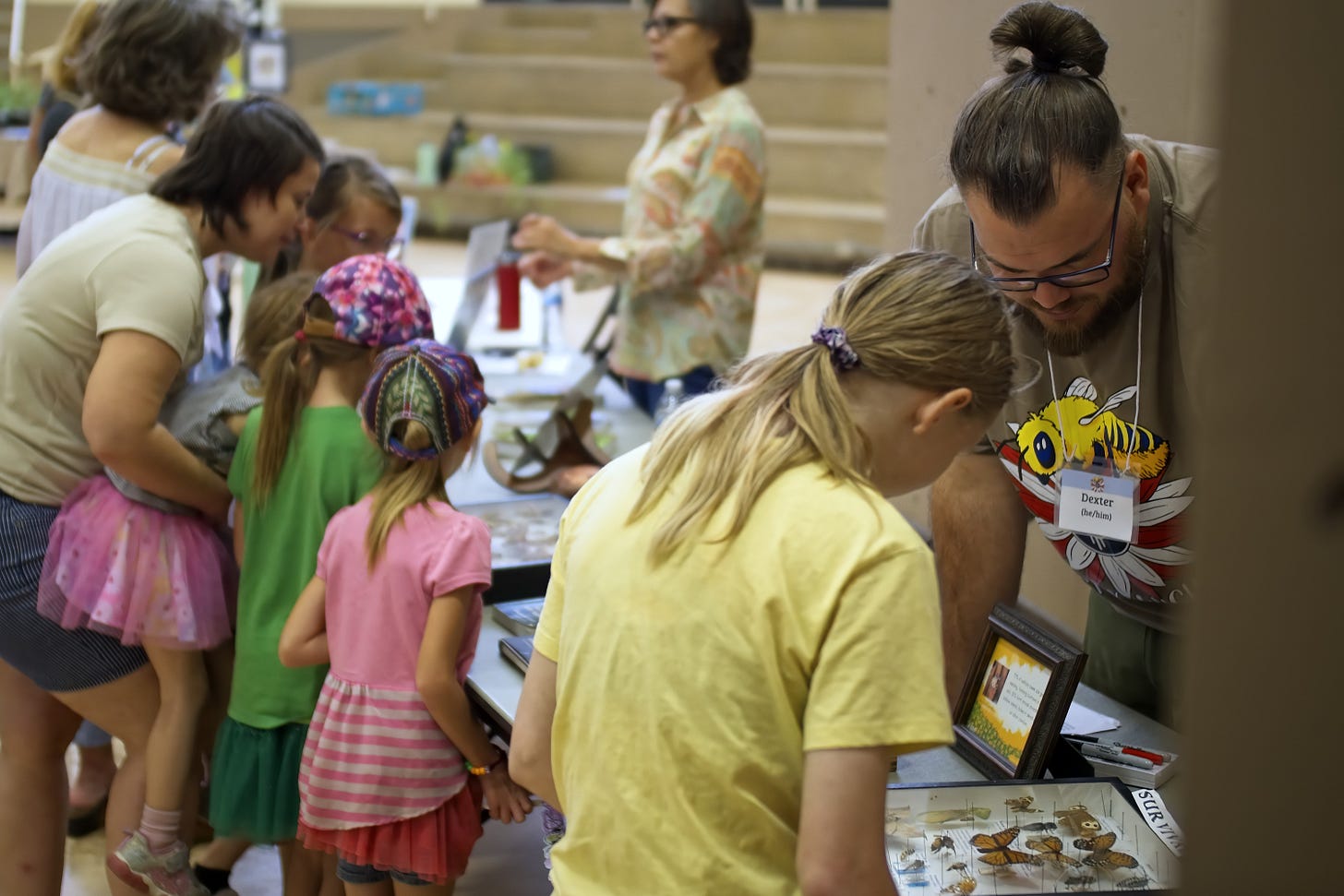 Volunteers Dexter and Krista talk about native gardening and insects with guests.