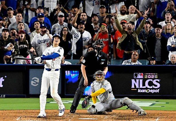 Los Angeles, CA Shohei Ohtani of the Los Angeles Dodgers watches his third solo home run against the Milwaukee Brewers in the seventh inning of game...