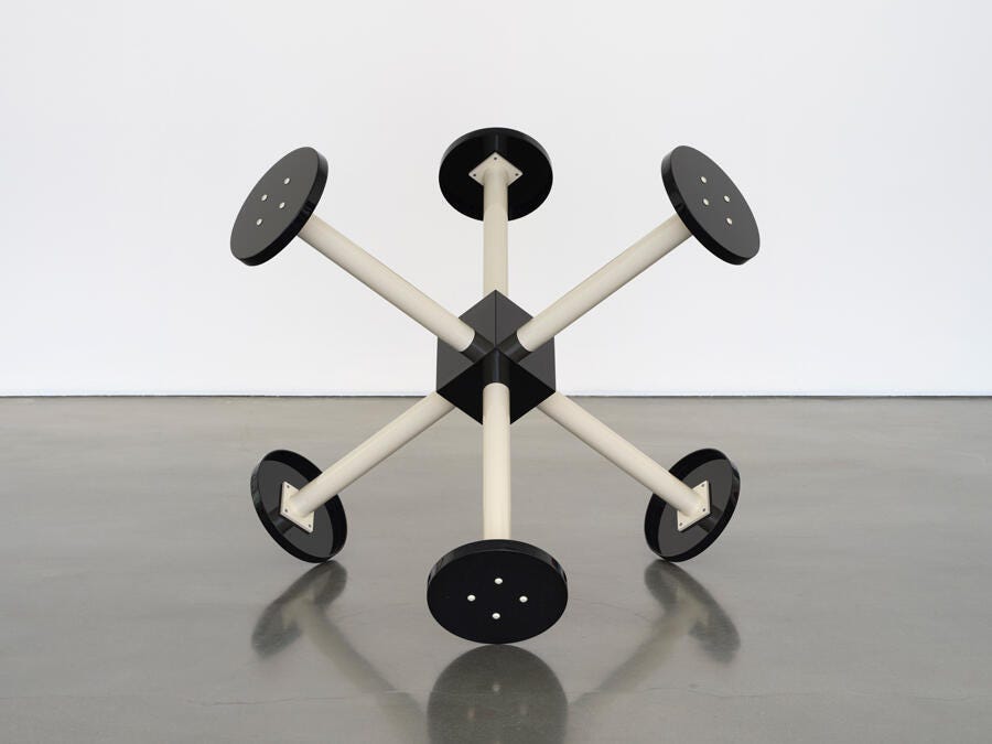 A giant jack (toy) made up of prison stools