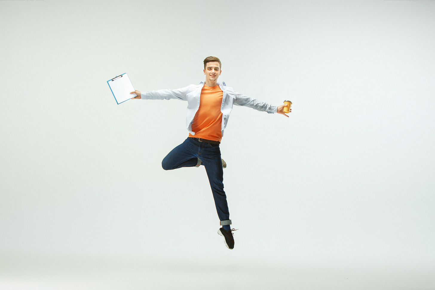 happy-young-man-working-office-jumping-dancing-casual-clothes-suit-isolated-white-background