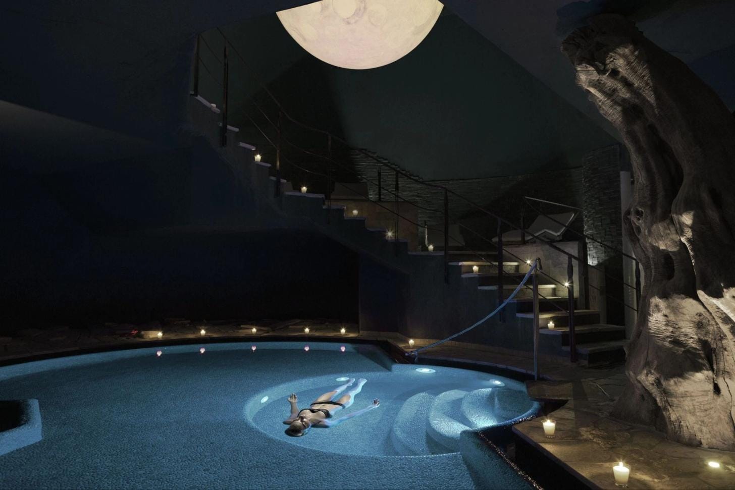 Guest floating in a wellness pool at Lefay Resort & SPA