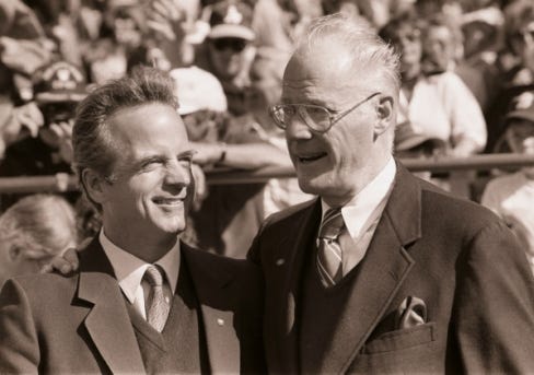 Baseball commissioner Bowie Kuh, right, puts his arm around Peter... Baseball commissioner Bowie Kuh, right, puts his arm around Peter...