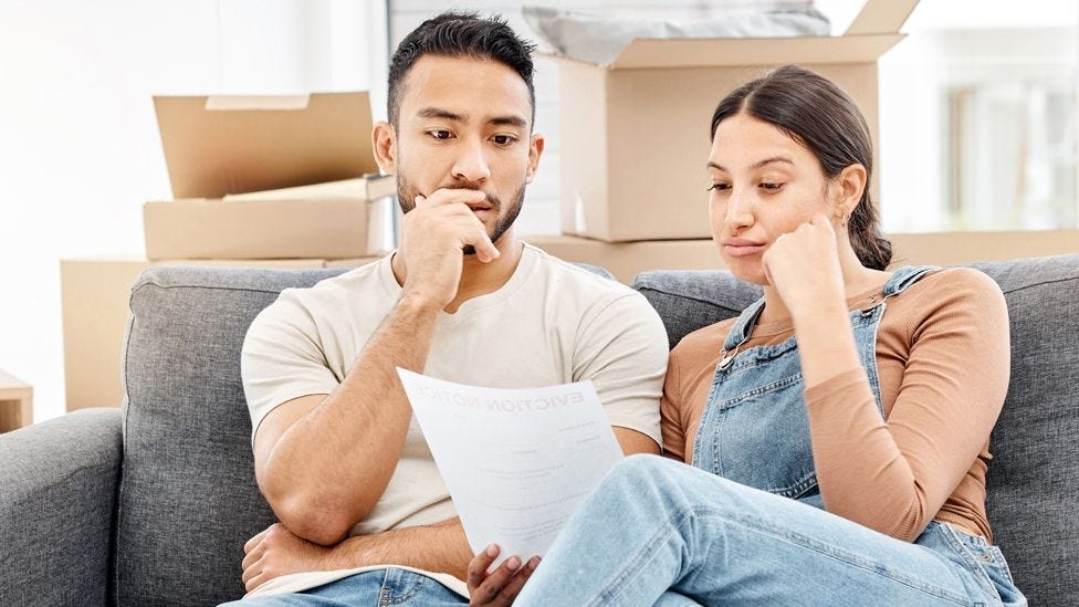 Couple looking at a bill Couple looking at a bill